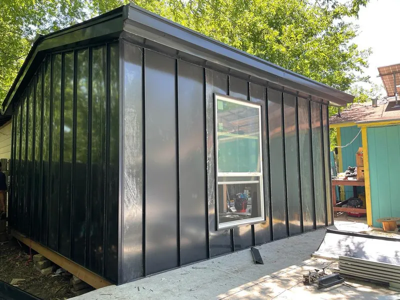 Black standing seam metal wall panels for Metal Roof Installation in Ravenna