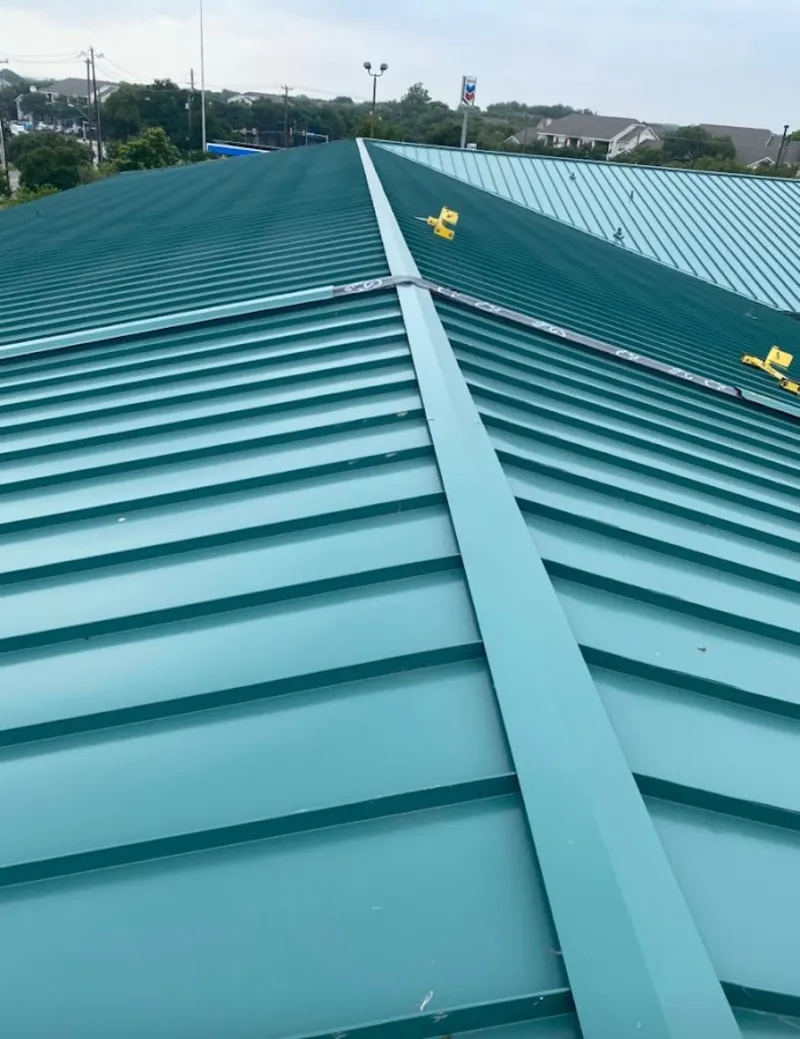 Green commercial metal roof ridge and valley for Metal Roof Repair in Ravenna