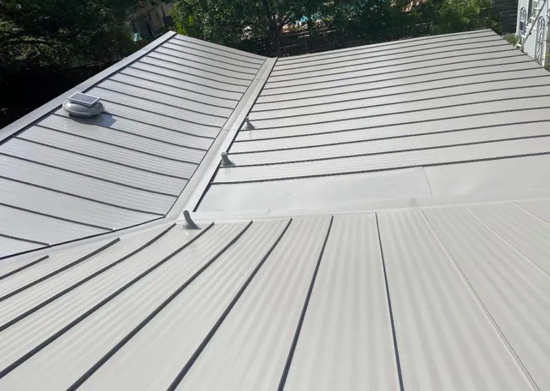 Solar attic fan installed on a metal roof for Roof Ventilation in Ravenna